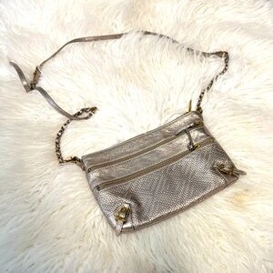 Excellent used condition. Worn once. Genuine leather. Dark Gold tone hardware.